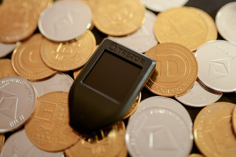 Crypto wallets like this Trezor can keep your investments safe indefinitely. (Image Source: rc.xyz NFT gallery on Unsplash.com)