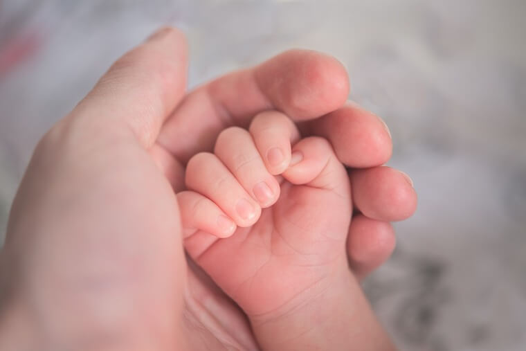 Just look at this tiny little hand. How would they ever be able to stop you!? (Image Source: Hu Chen on Unsplash.com)